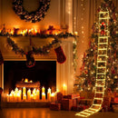 Outdoor balcony decorated with Santa Claus climbing ladder.